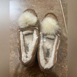 Tan Ugg moccasins with fur Pom Pom